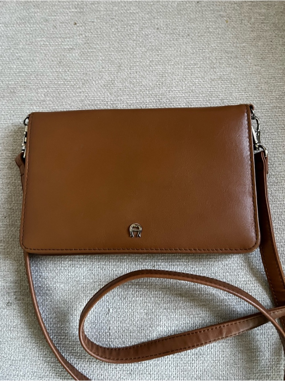 Etienne Aigner brown leather crossbody bag.